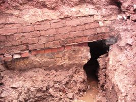 The culvert wall across the tailrace