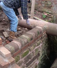John puts the finishing touches to the end wall.