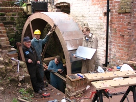 The last bucket is offered up for fitting