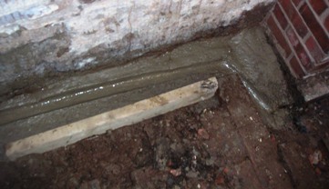 The gutter leading to the new drain