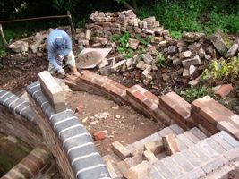 Curved brick wall under construction