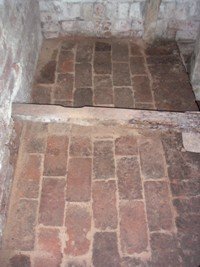 Brick flooring under the PTO shaft.