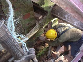 Dave works around the waterwheel.